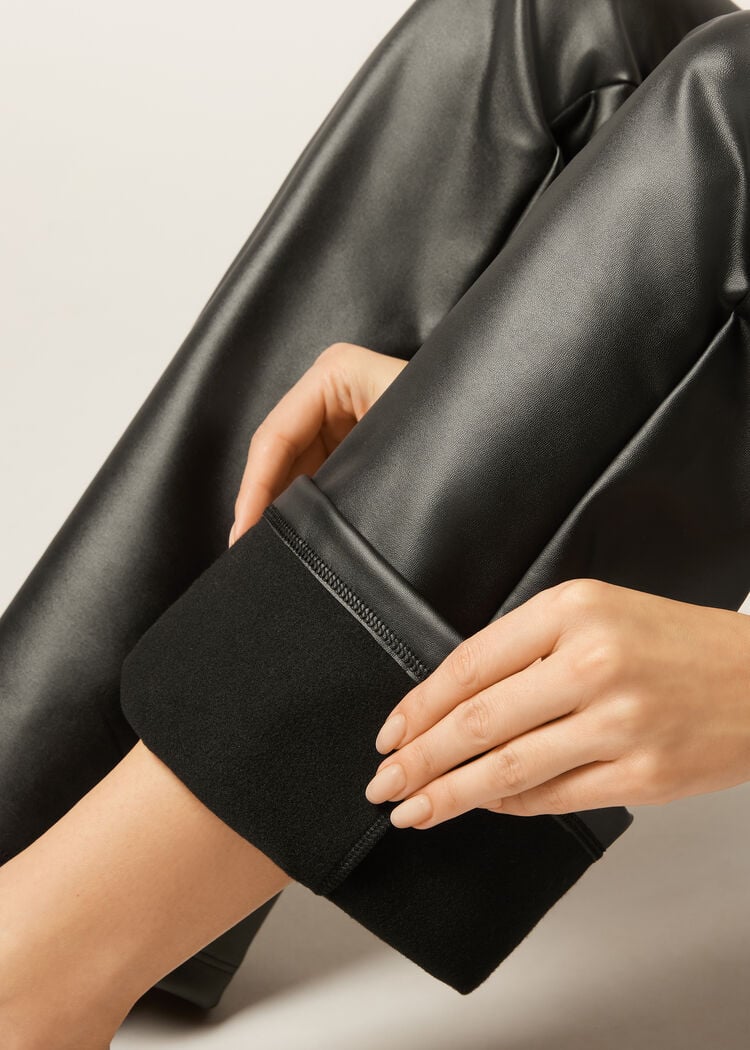 Thermal flared pants with coated effect