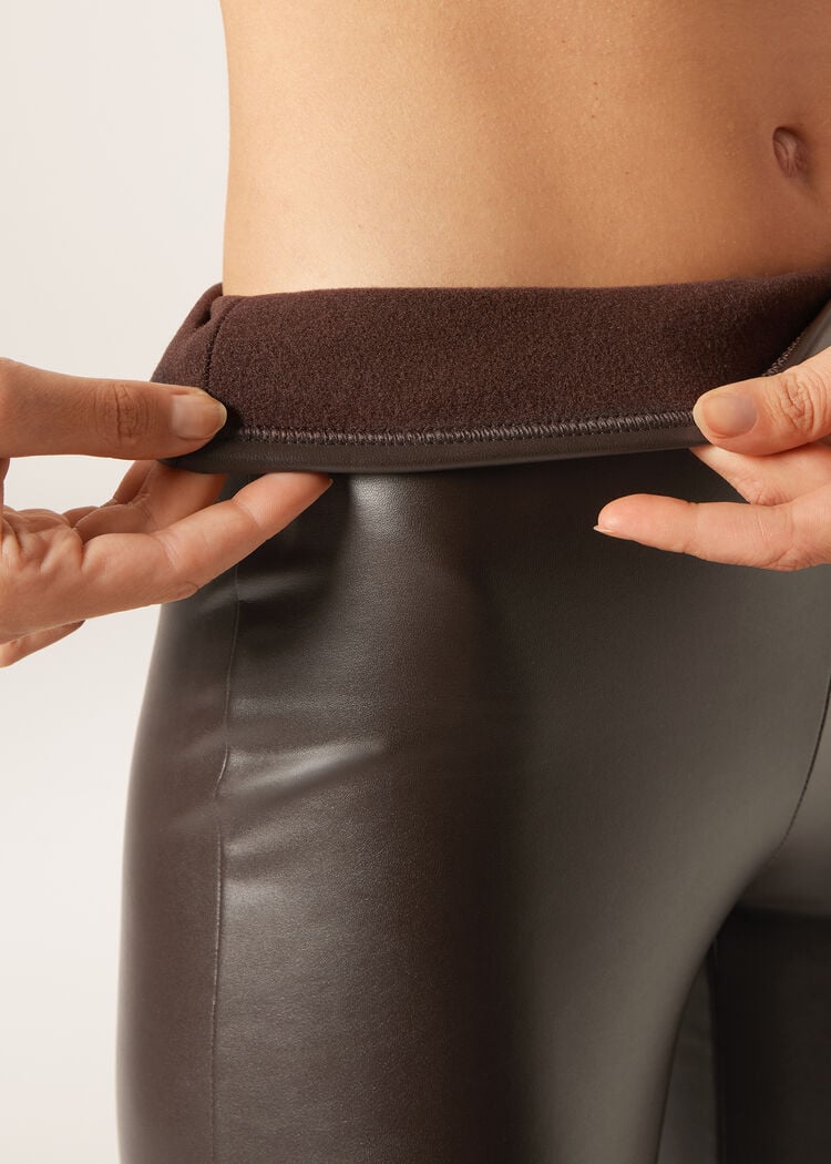 Thermal flared pants with coated effect